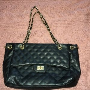 Quilted bag with gold rope chain handles